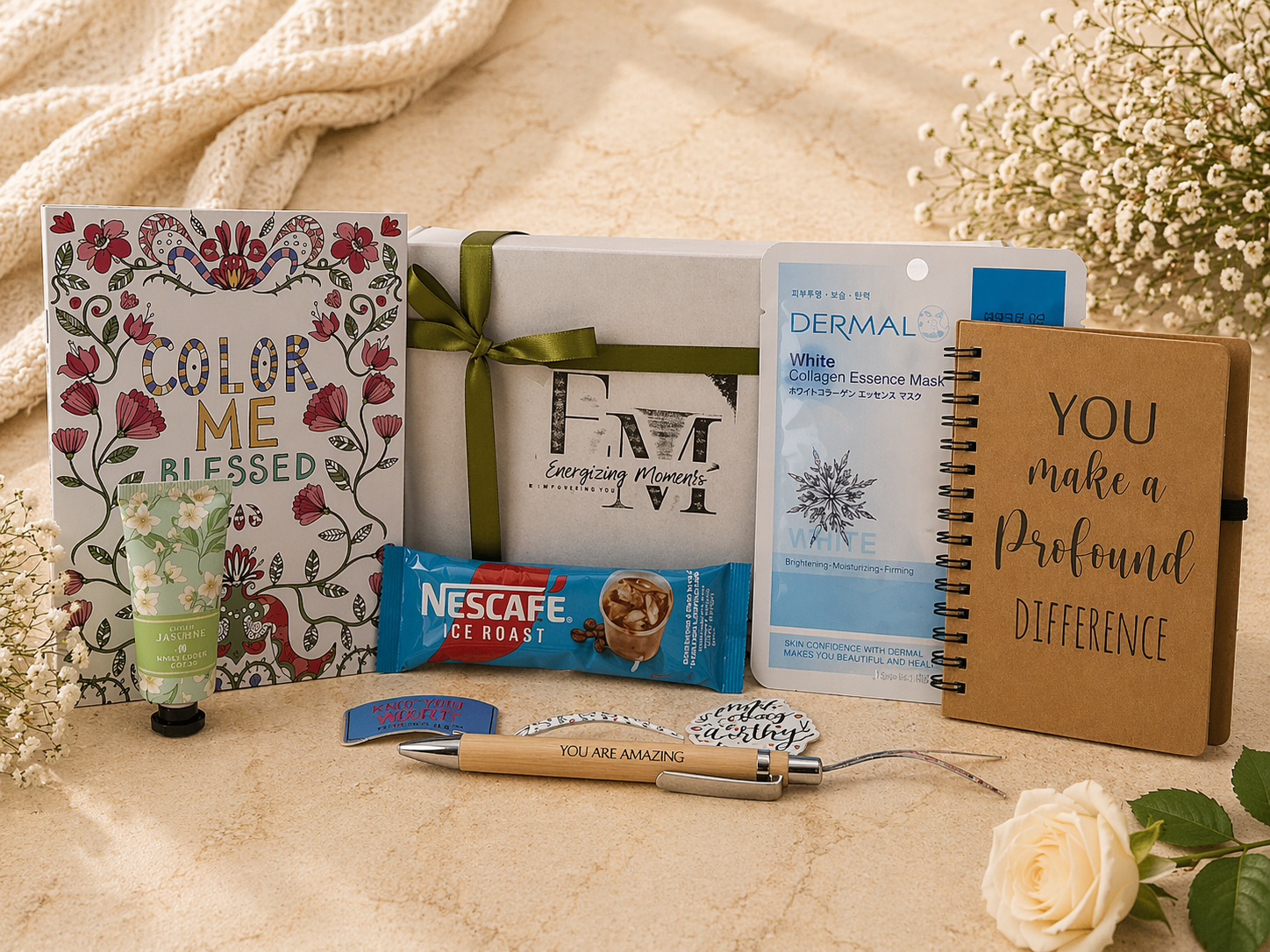 Collection of items including a notebook, Nescafe packet, and other products on a textured surface with flowers in the background.