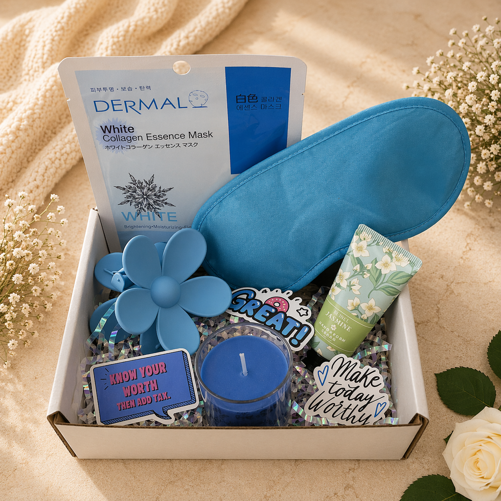 Gift box with blue eye mask, flower-shaped items, and motivational phrases on a beige background.