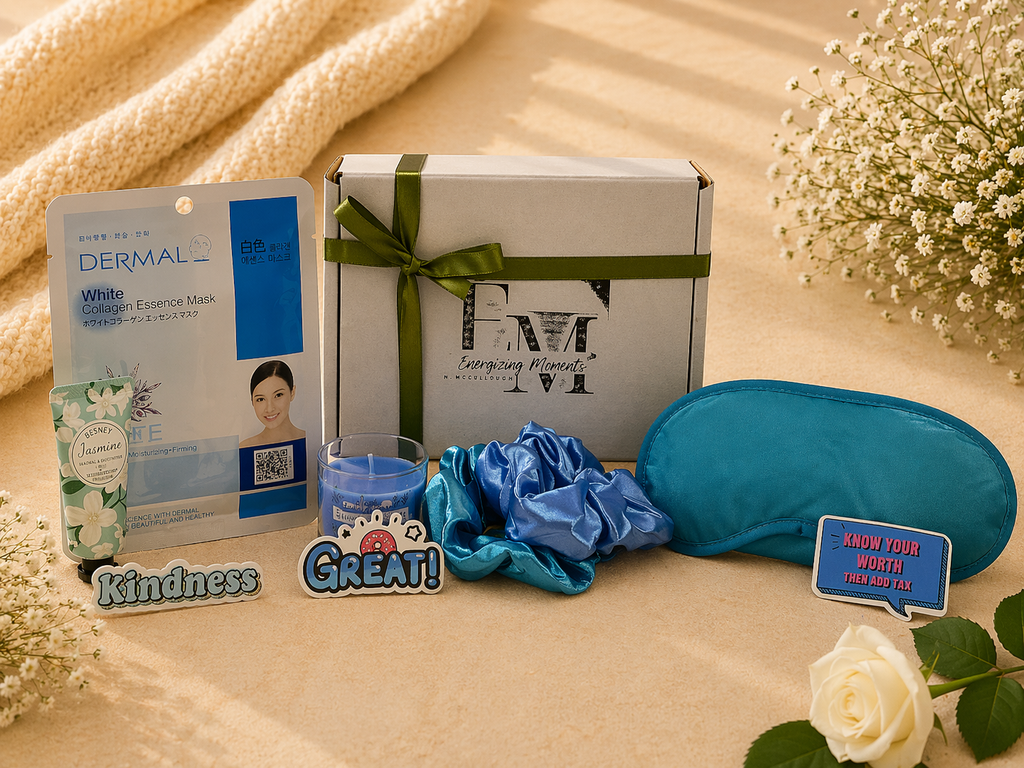 Gifting set with Dermal mask, gift box, scrunchie, and eye mask on a soft surface with flowers.